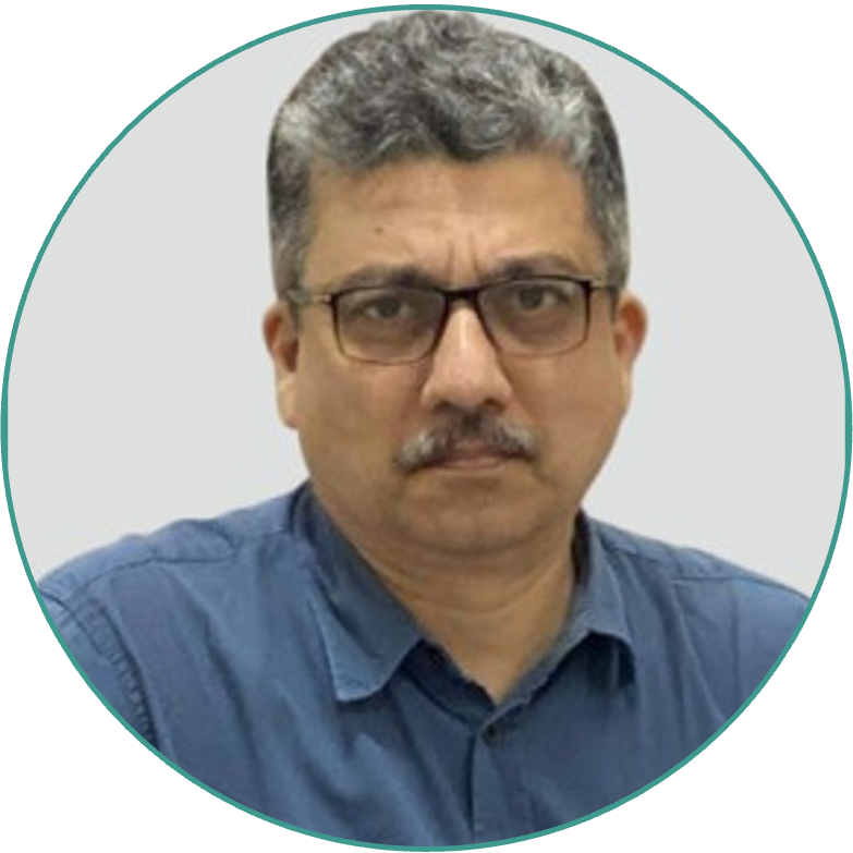 Ashim Purohit, Chief Business Officer in glasses and blue shirt